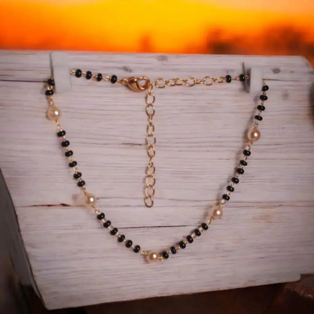 BT006 – Classic Black Bead & Pearl Anklet with Gold-Tone Chain