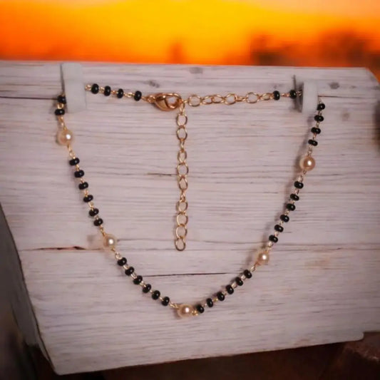 BT006 – Classic Black Bead & Pearl Anklet with Gold-Tone Chain