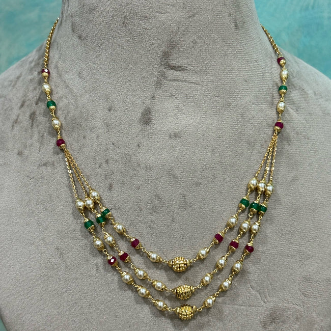 elegant necklace features a stunning Swarovski pearl, along with a Chetan Ruby and a Chetan patcha